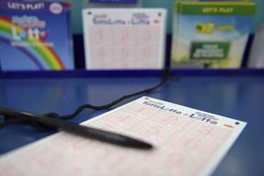 A coupon for Tatts Group Ltd.'s TattsLotto lottery game is arranged for a photograph at a newsagent's store in Melbourne, Australia, on Thursday, Dec. 15, 2016. A consortium including Morgan Stanley and KKR & Co. offered as much as A$7.3 billion ($5.5 billion) for Australian betting and lotteries business Tatts Group, setting up a potential bidding war with Tabcorp Holdings Ltd. Photographer: Carla Gottgens/Bloomberg via Getty Images